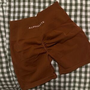 Alphalete amplify shorts in brown